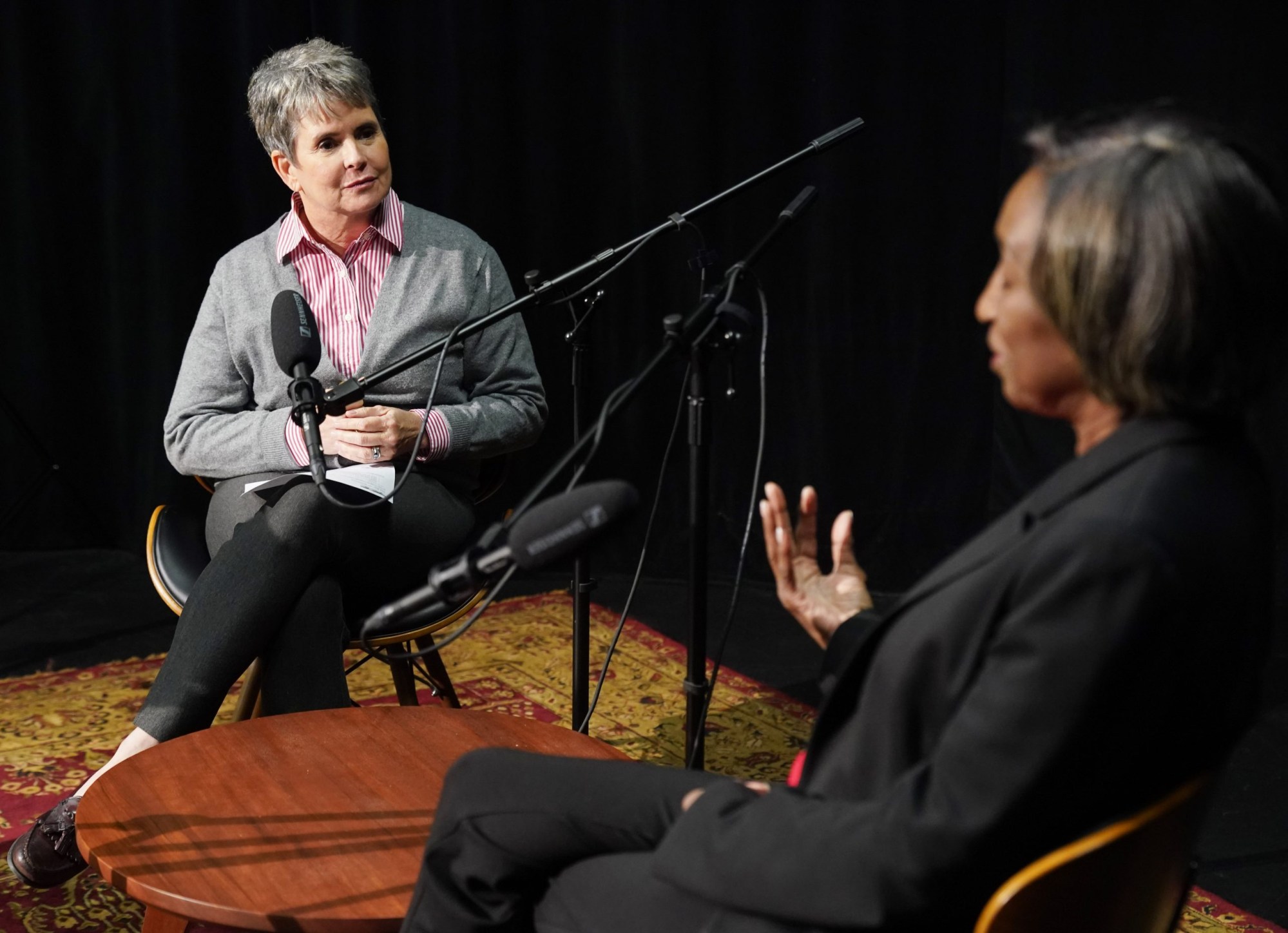 Demetria Kalodimos sits at a microphone and talks with former Banner reporter Tam Gordon.